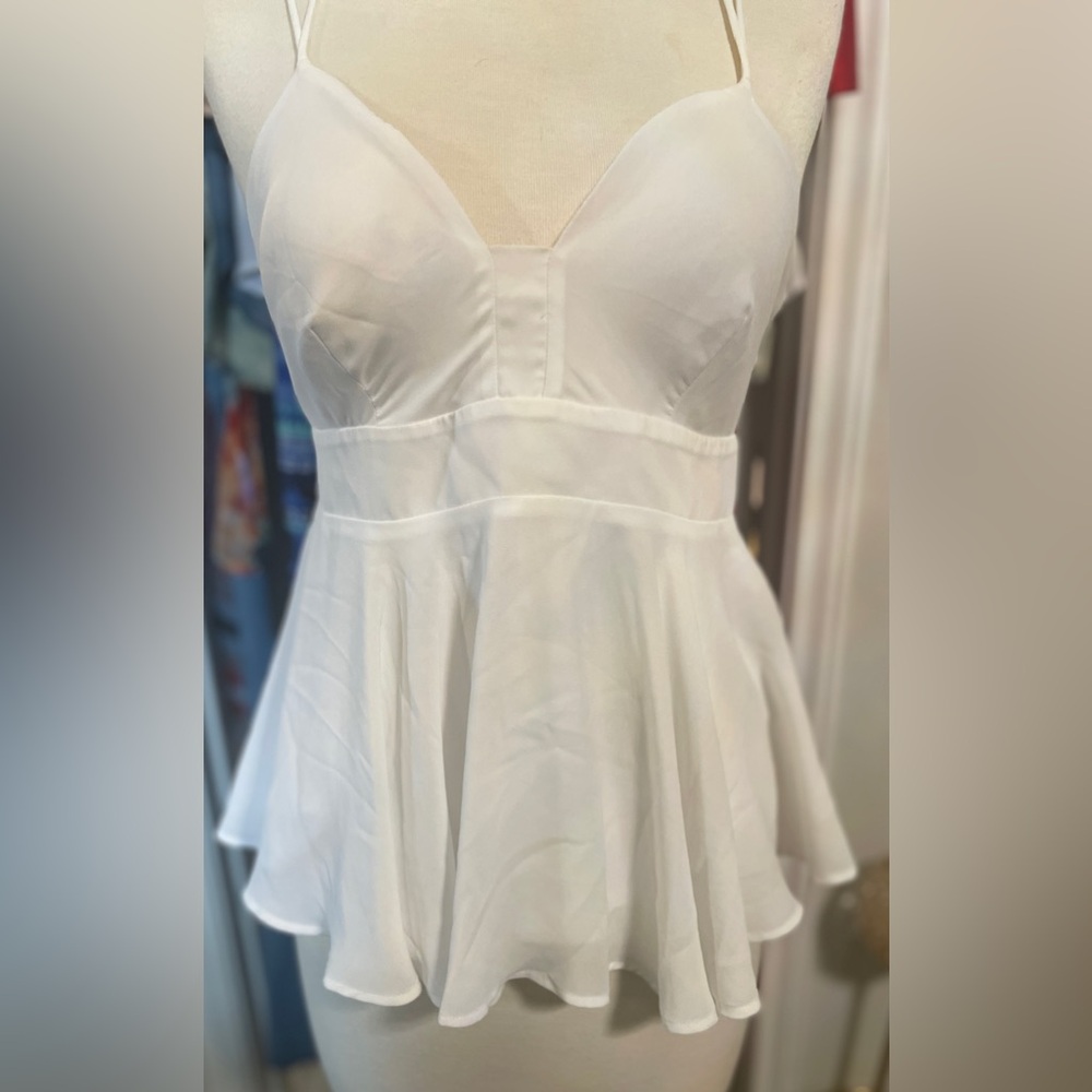 Dramatic back white peplum shirt